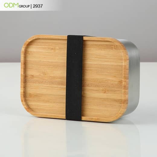 Bamboo bento lunch box with black strap.