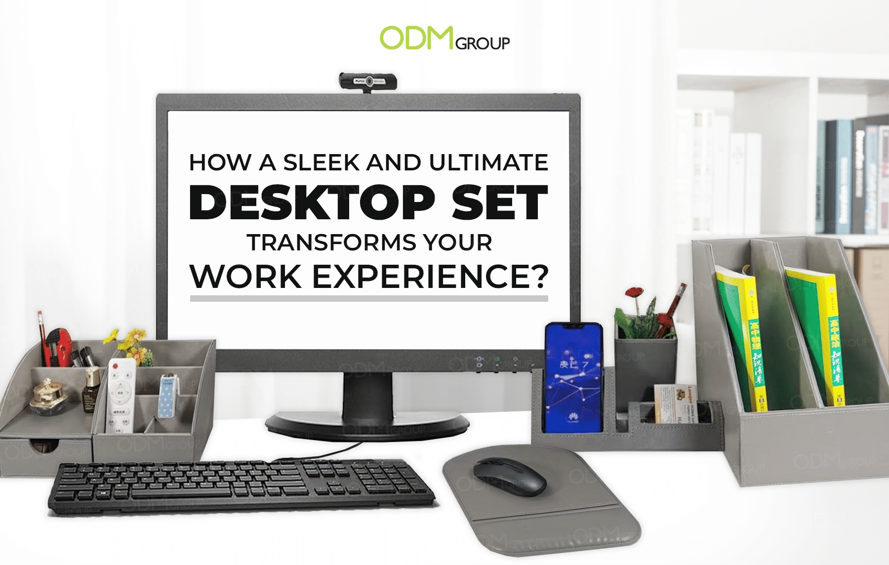 A sleek and organized desktop set including a monitor, keyboard, and various office accessories.