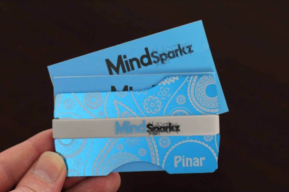 Blue aluminium wallet with MindSparkz branding.