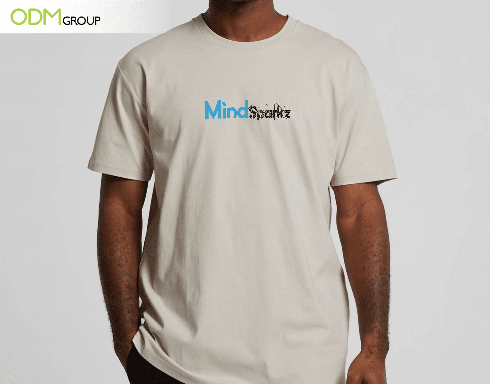 Person wearing a custom t-shirt with MindSparkz logo by ODM Group.