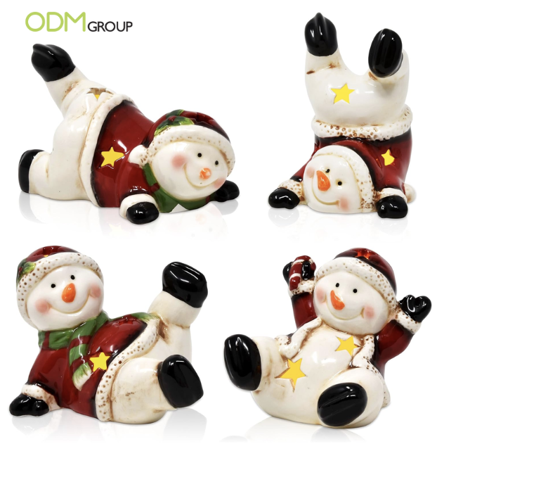 Cute ceramic snowmen figurines in various poses.