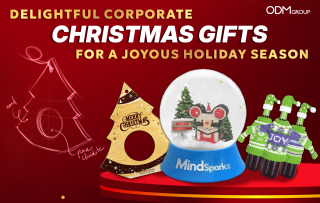 Assortment of delightful corporate Christmas gifts including snow globe and chocolates.