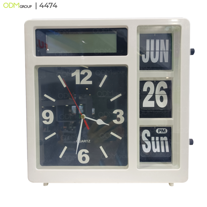 White desk clock with analog time and rotating date display.