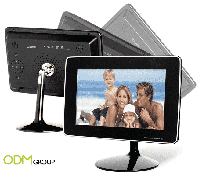 Modern digital photo frame displaying a family photo, a thoughtful corporate holiday gift idea.