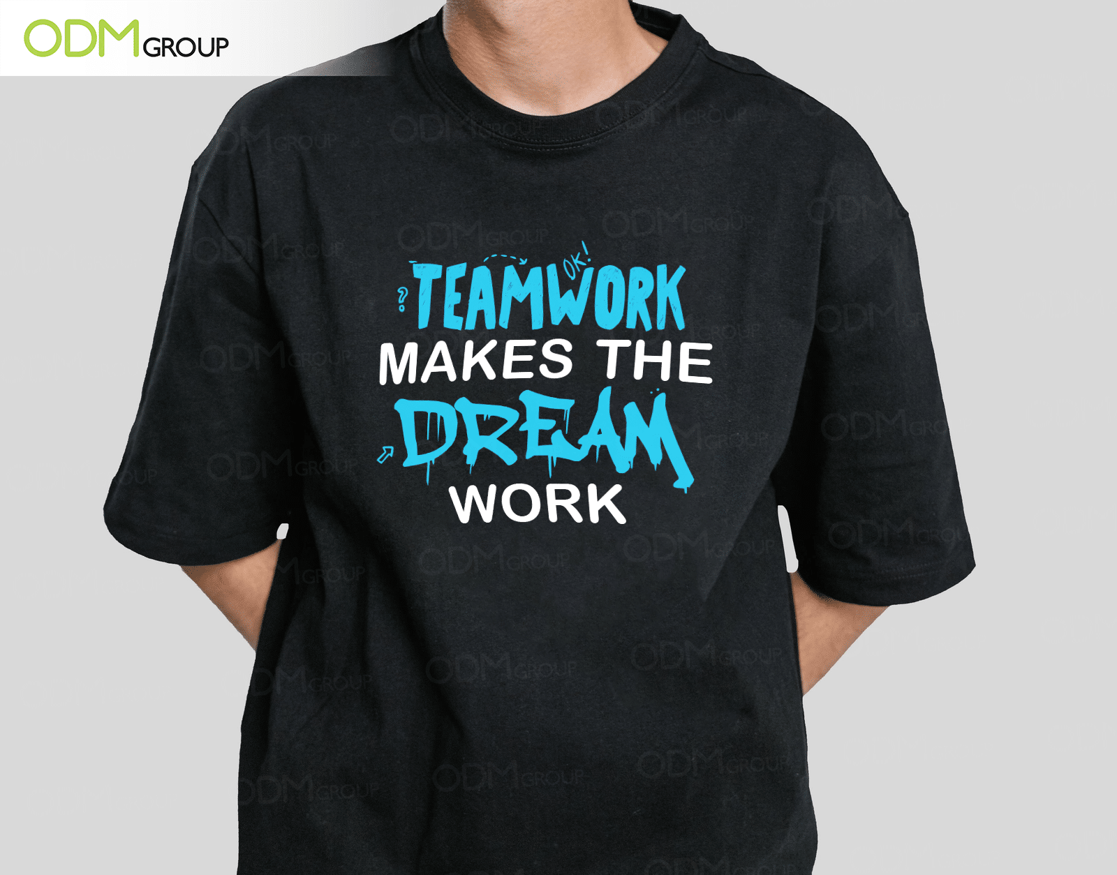 Black t-shirt with the phrase "Teamwork makes the dream work" in blue and white text.