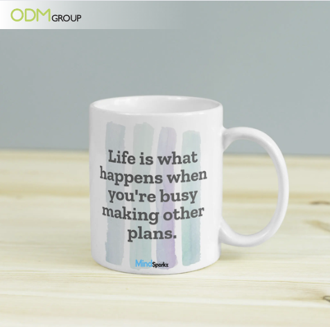 White coffee mug with the quote "Life is what happens when you're busy making other plans."