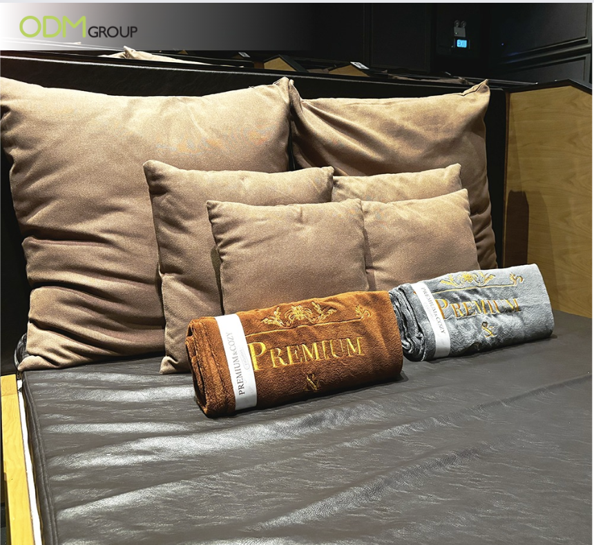 Premium blankets and pillows arranged on a cozy seating area for a movie marathon - Ideas for Employee Appreciation Day
