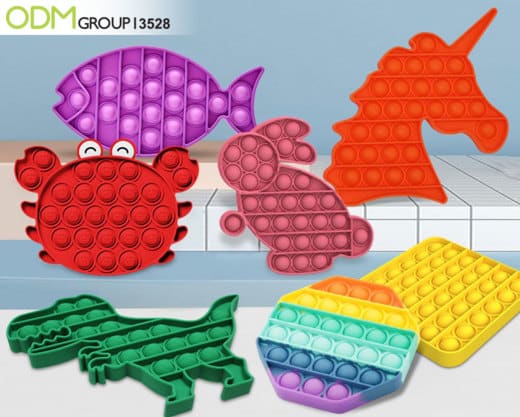 "Colorful fidget toys in various shapes including fish, unicorn, and dinosaur."