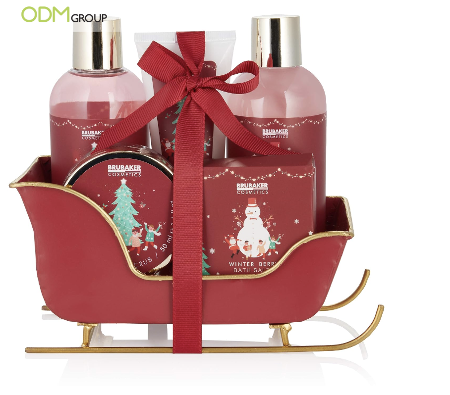 Christmas-themed bath set in a red sleigh with ribbon.