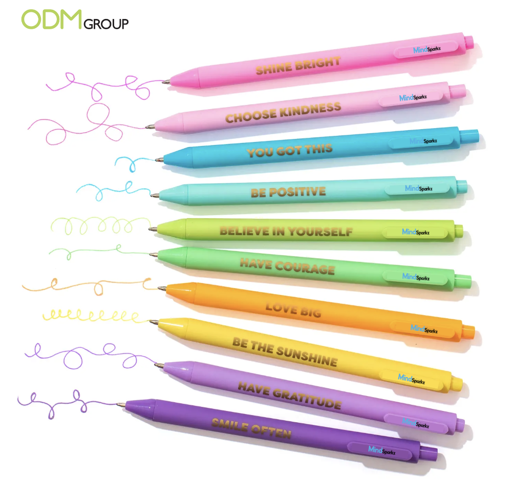 A collection of colorful pens with phrases like "Shine Bright," "Choose Kindness," and "You Got This."