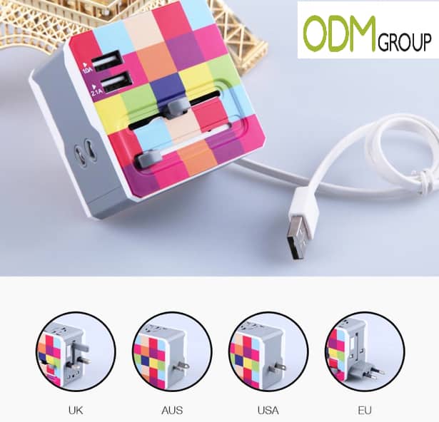 Colorful promotional travel charger with multiple plugs for international use, ideal for corporate holiday gifts.
